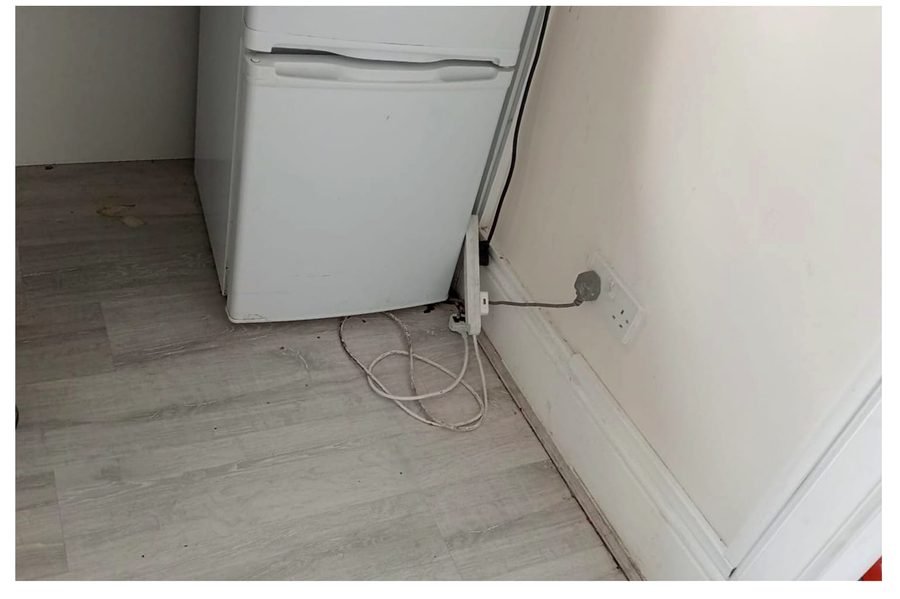 Behind the fridge after deep cleaning